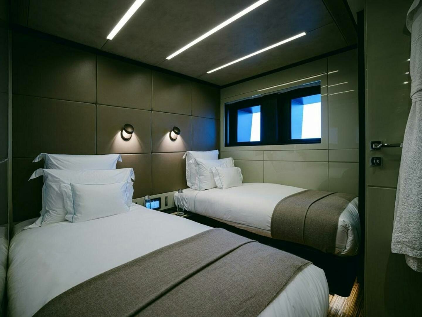 a couple of beds in a room aboard BARTALI Yacht for Sale