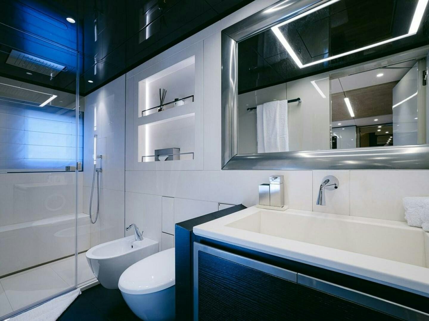a bathroom with a large mirror aboard BARTALI Yacht for Sale