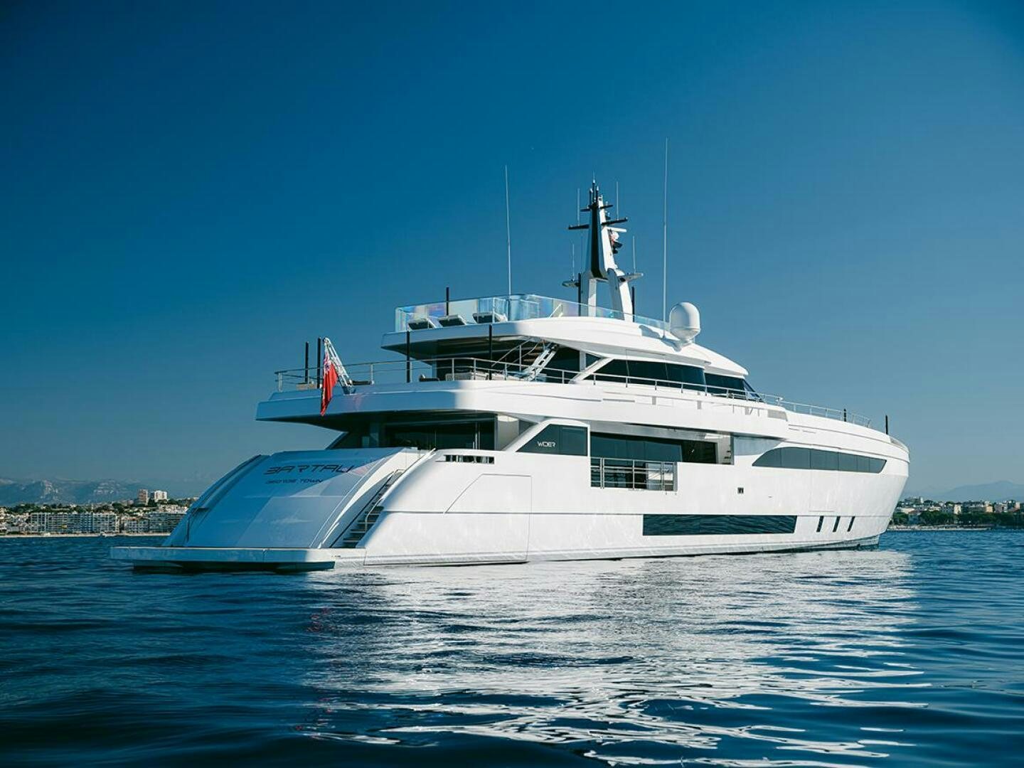 a white yacht on the water aboard BARTALI Yacht for Sale
