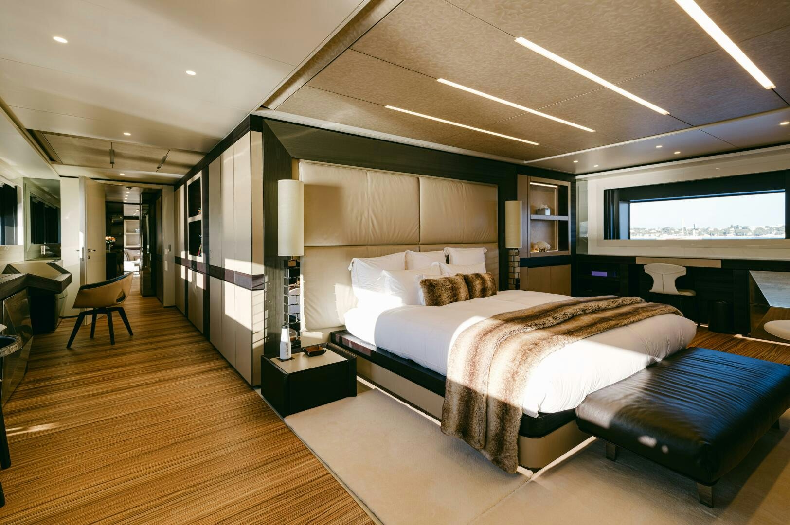a large bedroom with a large bed aboard BARTALI Yacht for Sale