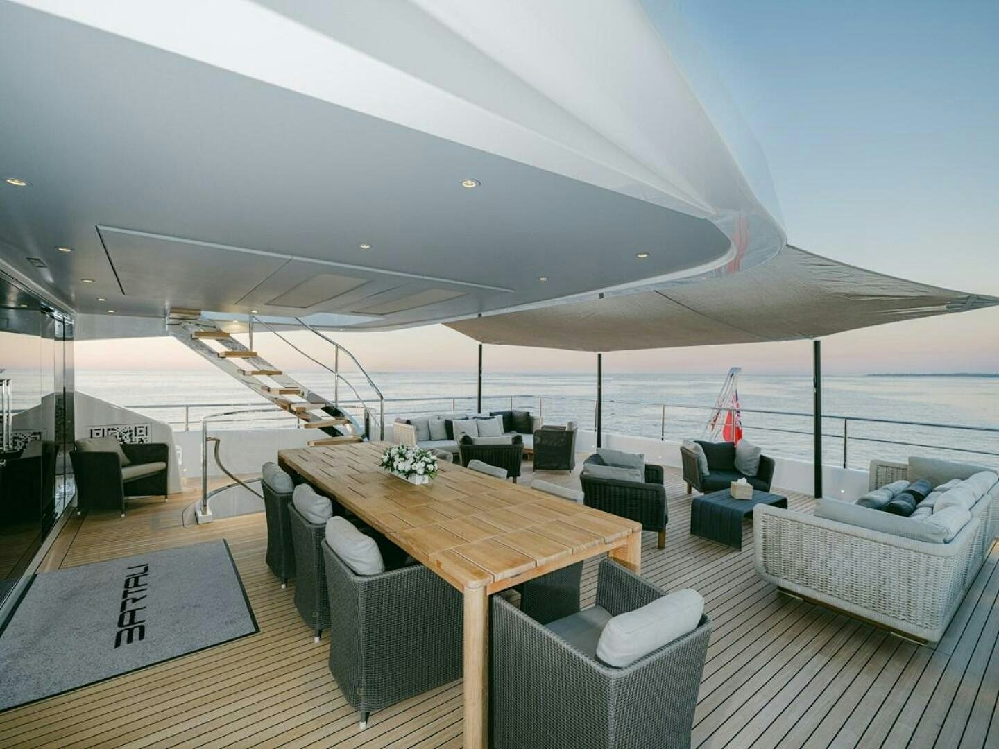 a room with a table and chairs aboard BARTALI Yacht for Sale