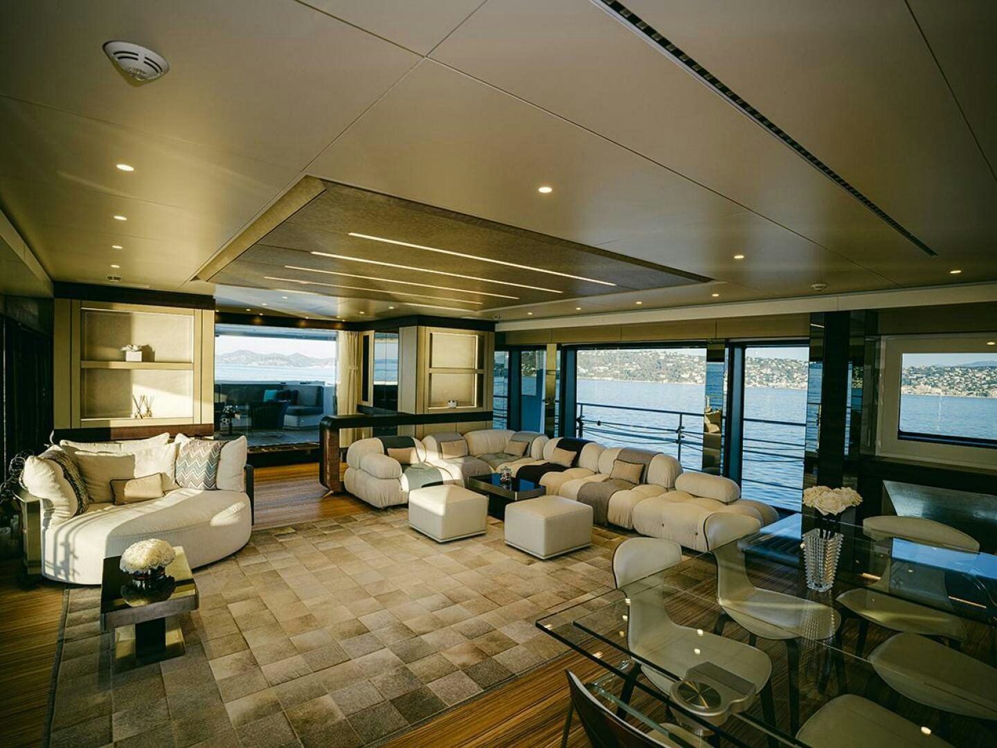 a living room with a large window aboard BARTALI Yacht for Sale