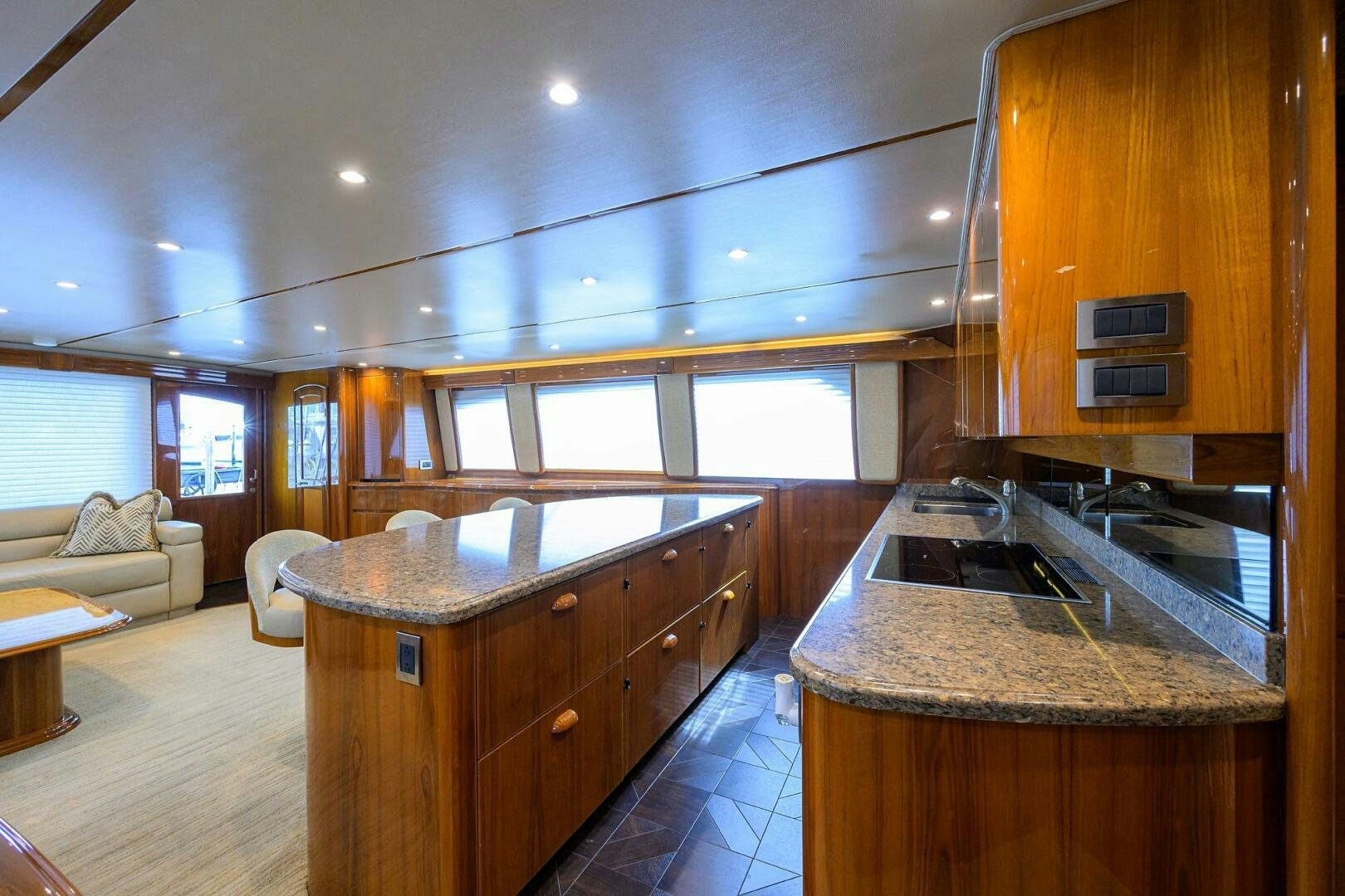 a kitchen with wooden cabinets aboard JUST CHILLIN Yacht for Sale