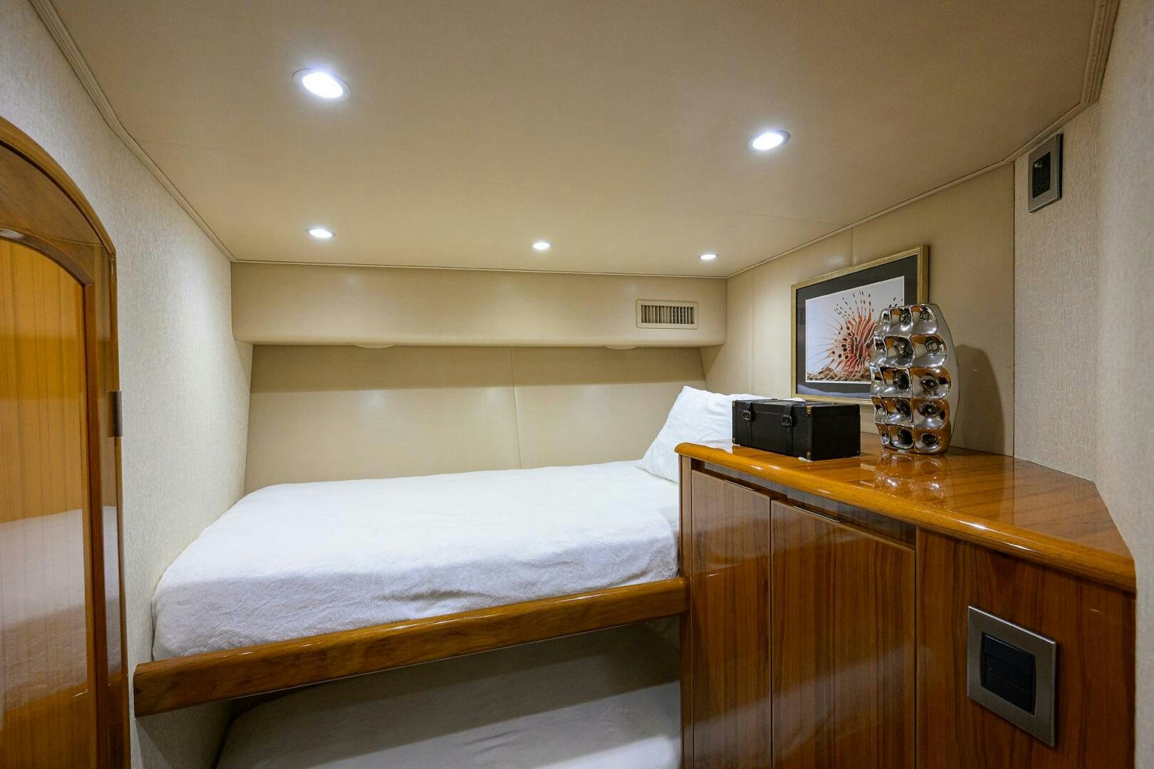 a room with a bed and a desk aboard JUST CHILLIN Yacht for Sale