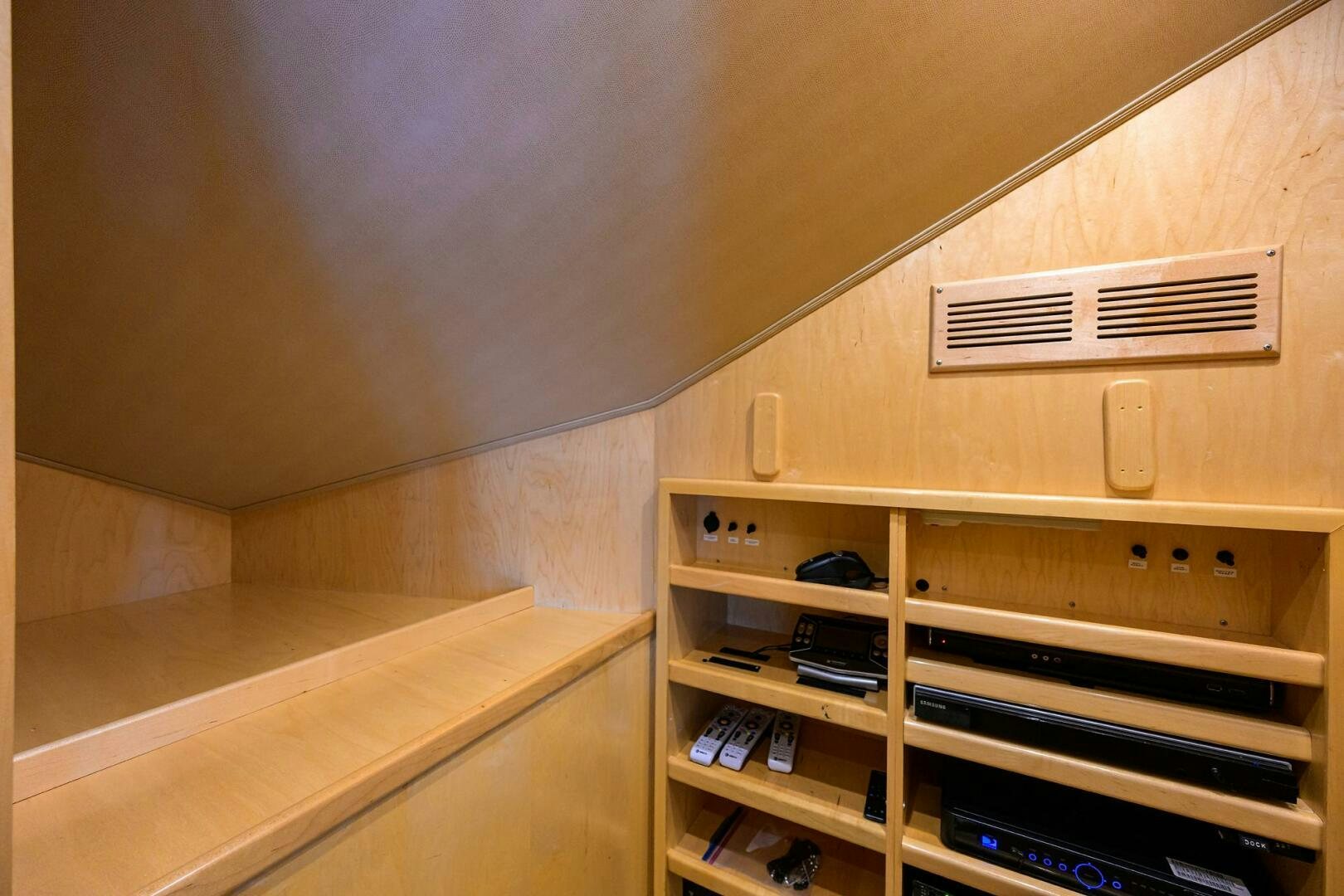 a wooden shelf with a phone and a book shelf aboard JUST CHILLIN Yacht for Sale