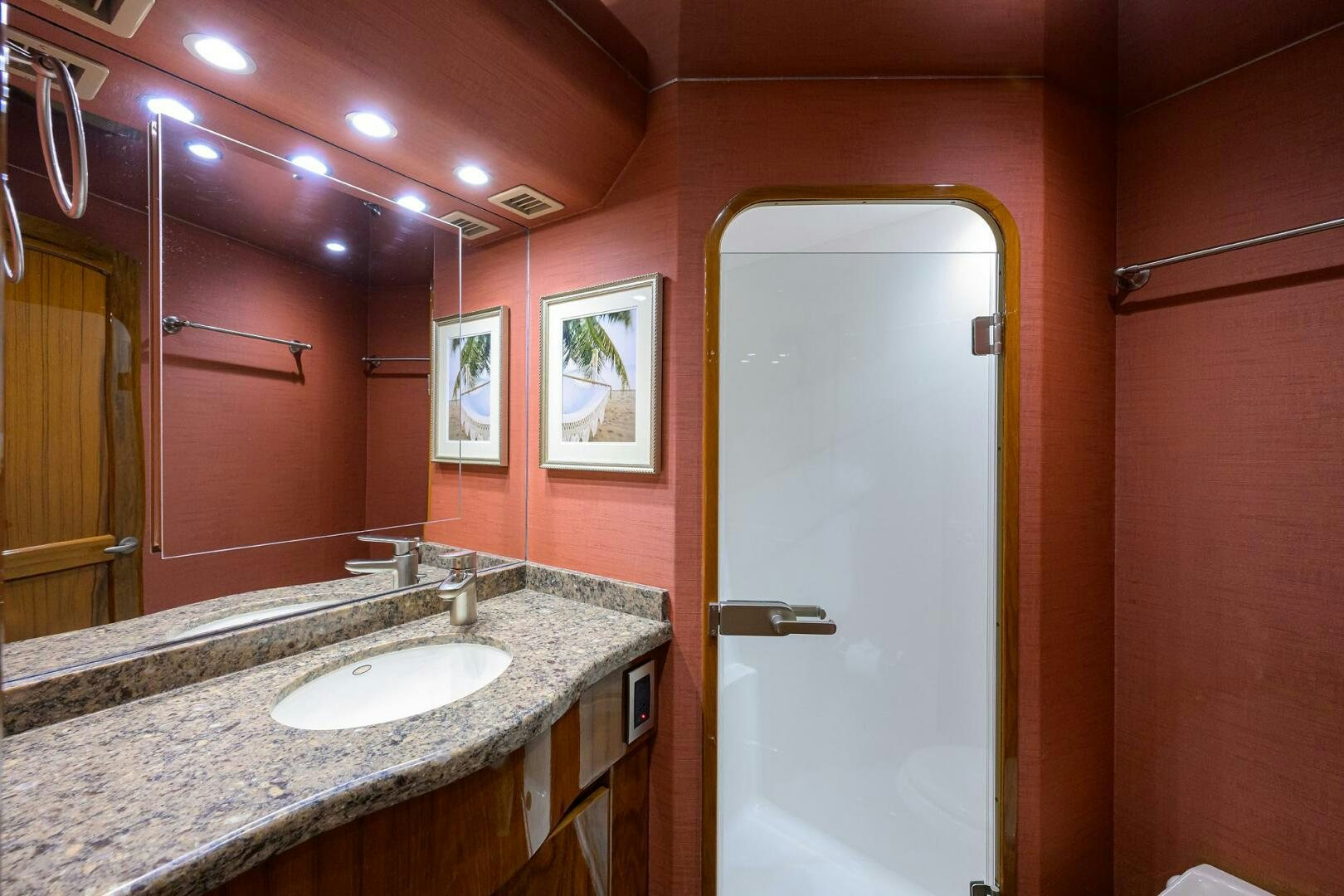 a bathroom with a large mirror aboard JUST CHILLIN Yacht for Sale