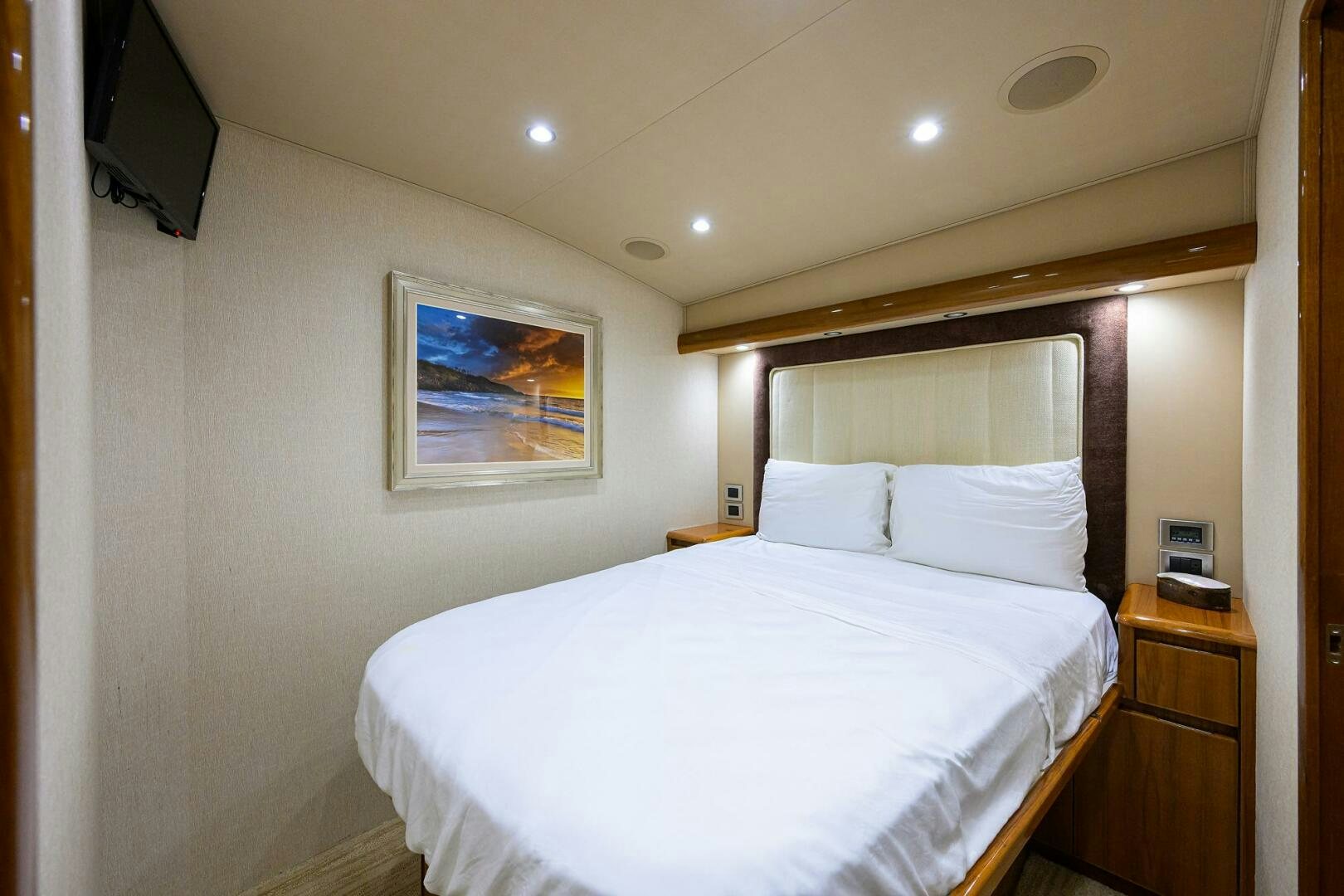 a bed with white sheets aboard JUST CHILLIN Yacht for Sale