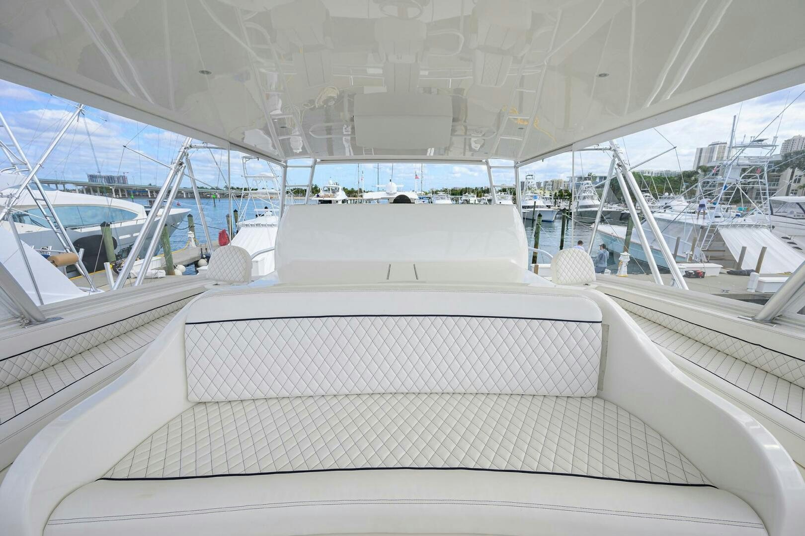 a white boat with a grey striped seat aboard JUST CHILLIN Yacht for Sale