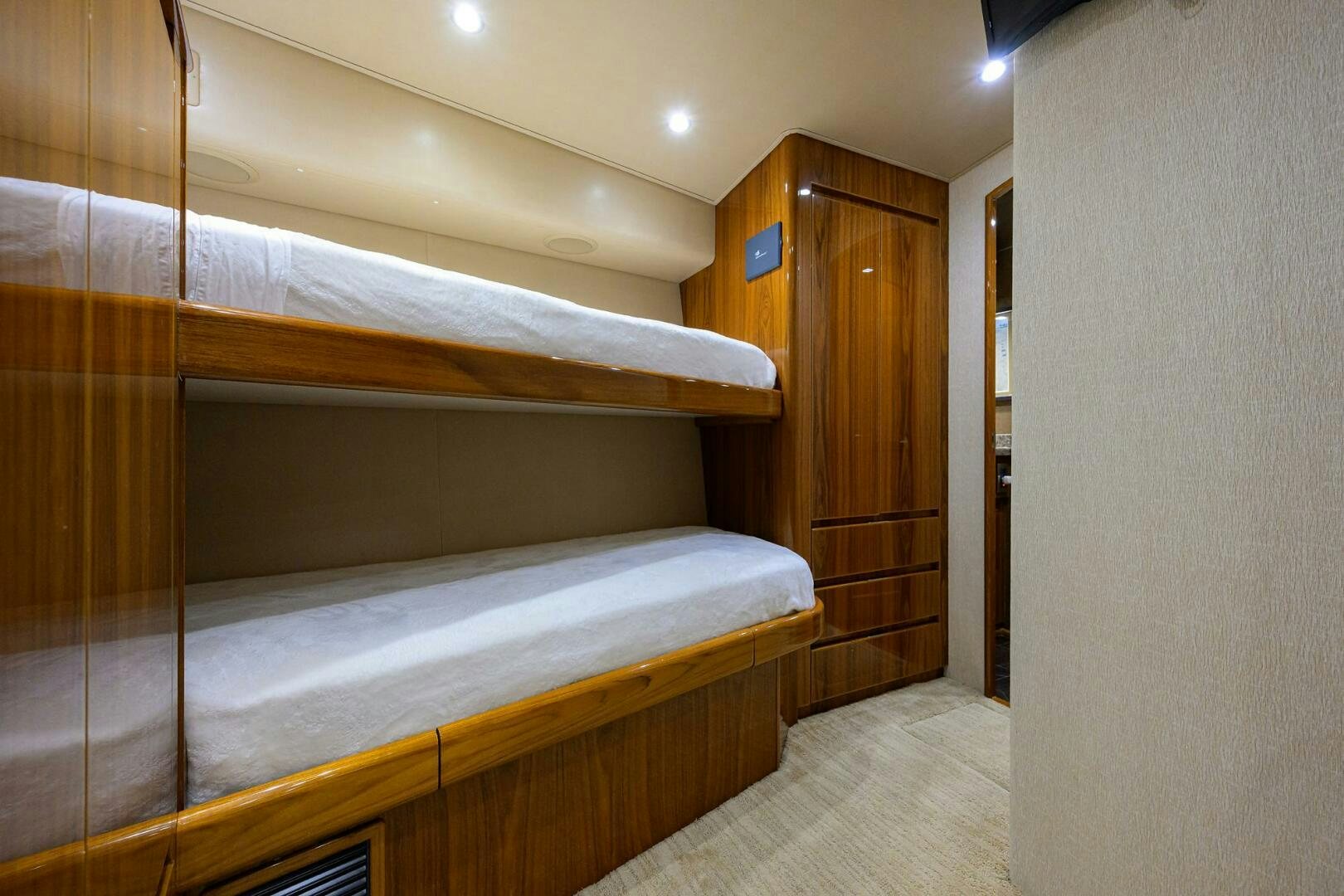 a room with a bed and a closet aboard JUST CHILLIN Yacht for Sale