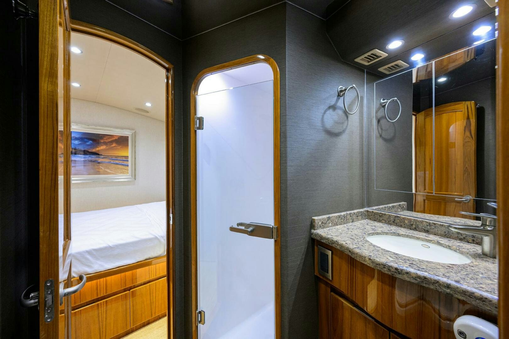 a bathroom with a sink and mirror aboard JUST CHILLIN Yacht for Sale