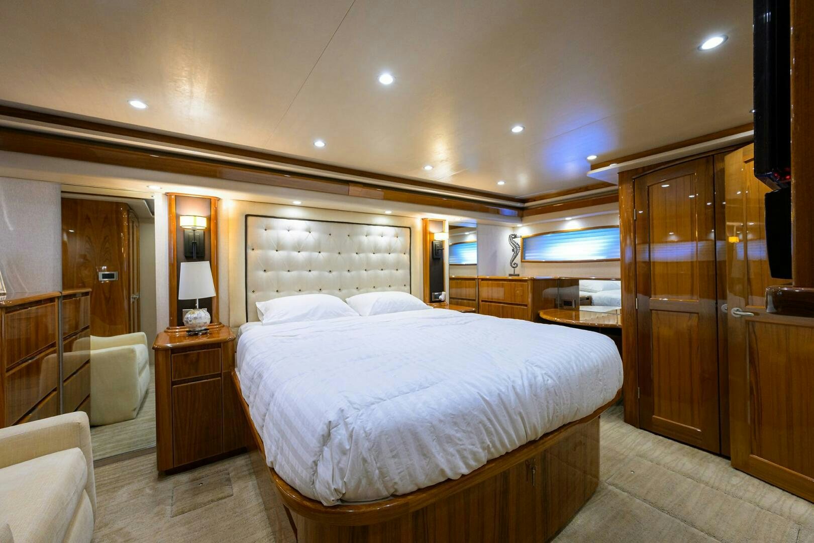 a bedroom with a bed and a closet aboard JUST CHILLIN Yacht for Sale