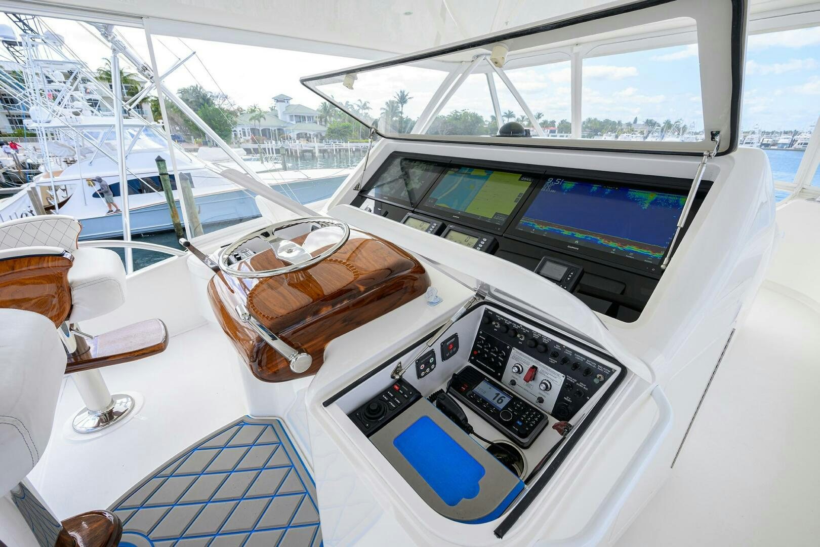 a boat with a computer monitor and a basket of food on it aboard JUST CHILLIN Yacht for Sale