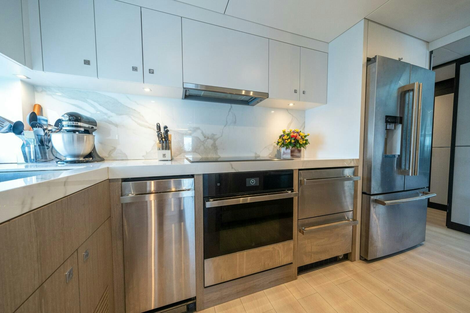 a kitchen with stainless steel appliances aboard DAY ONE Yacht for Sale