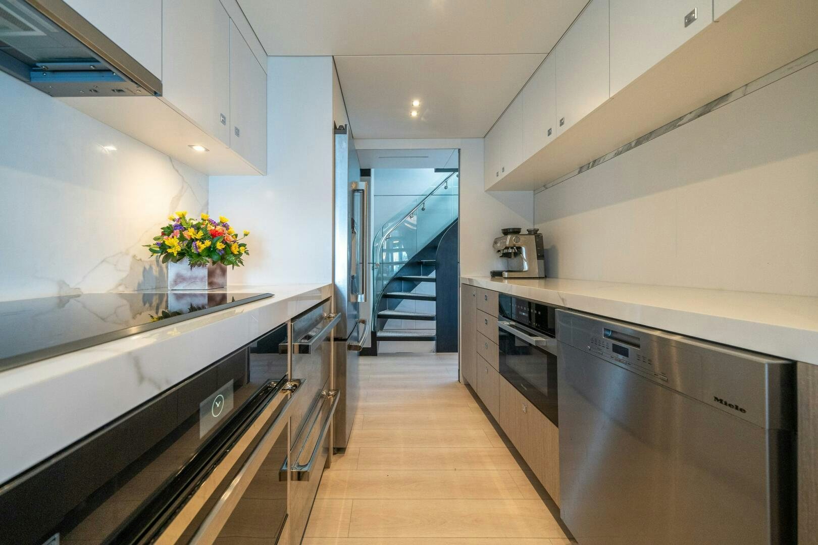 a kitchen with a staircase aboard DAY ONE Yacht for Sale