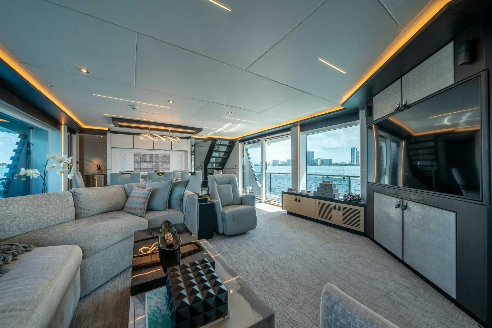 a living room with a large open window aboard DAY ONE Yacht for Sale