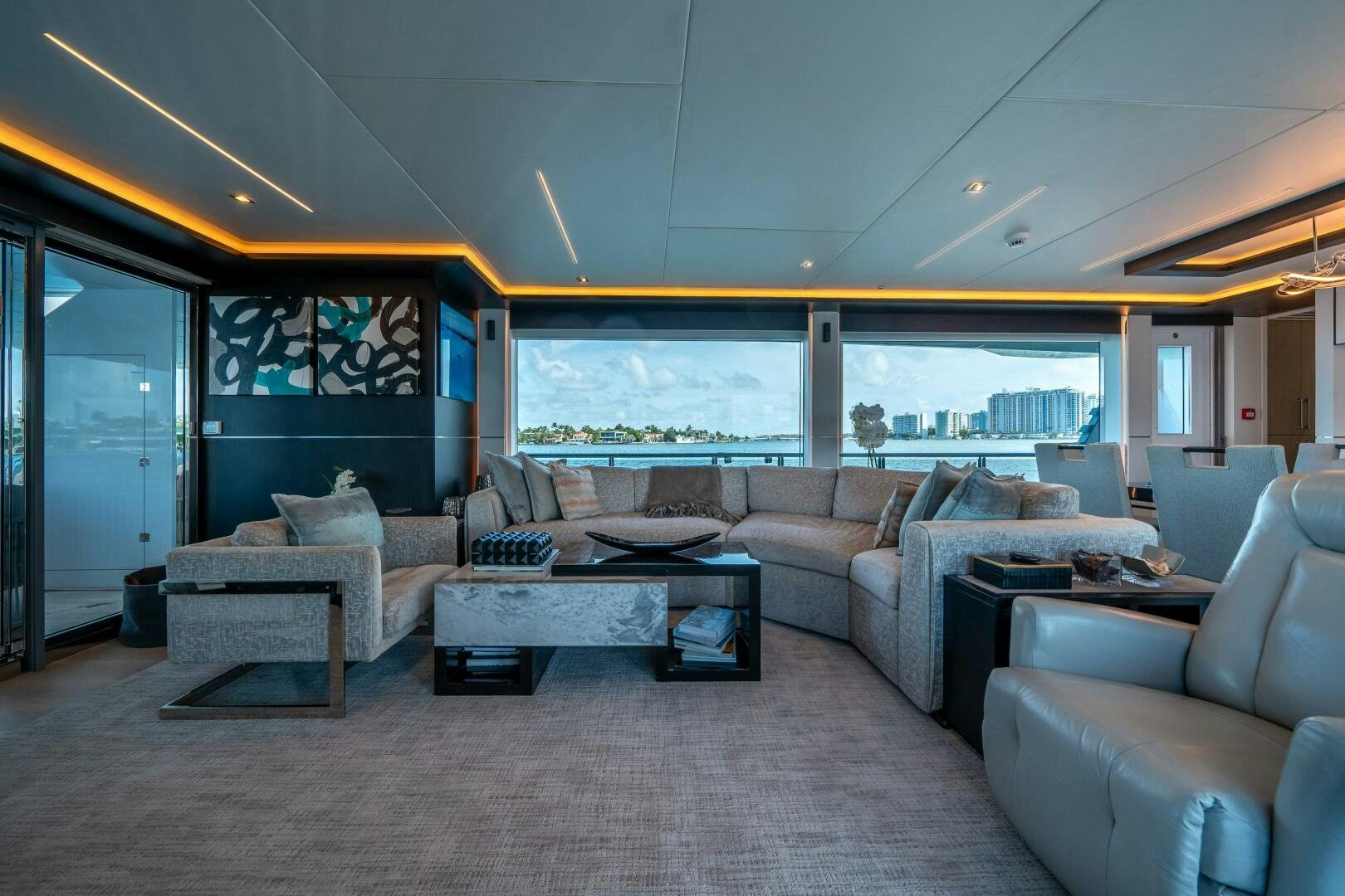a living room with couches aboard DAY ONE Yacht for Sale