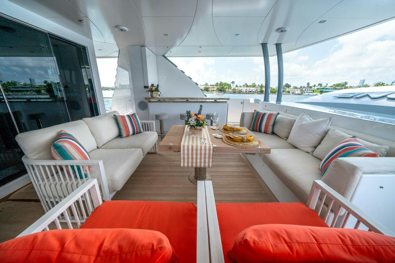 a living room with a table and chairs aboard DAY ONE Yacht for Sale