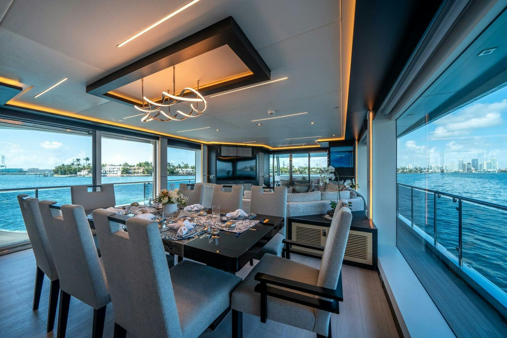 a dining room with a large window aboard DAY ONE Yacht for Sale