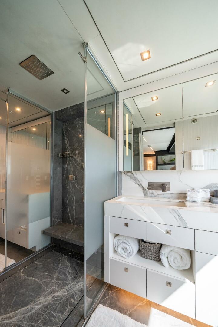 a bathroom with a large mirror aboard DAY ONE Yacht for Sale