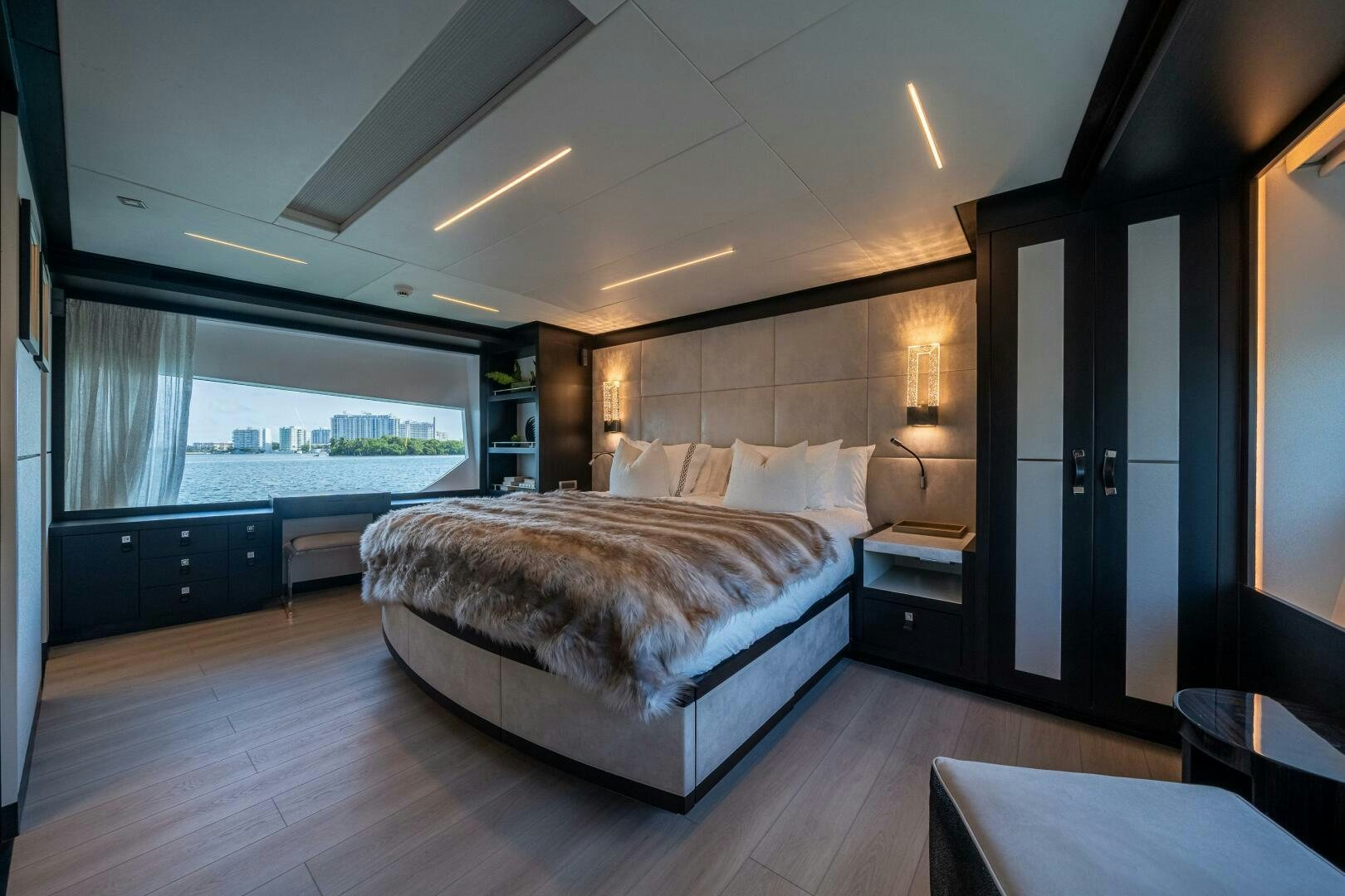 a large bedroom with a large bed aboard DAY ONE Yacht for Sale