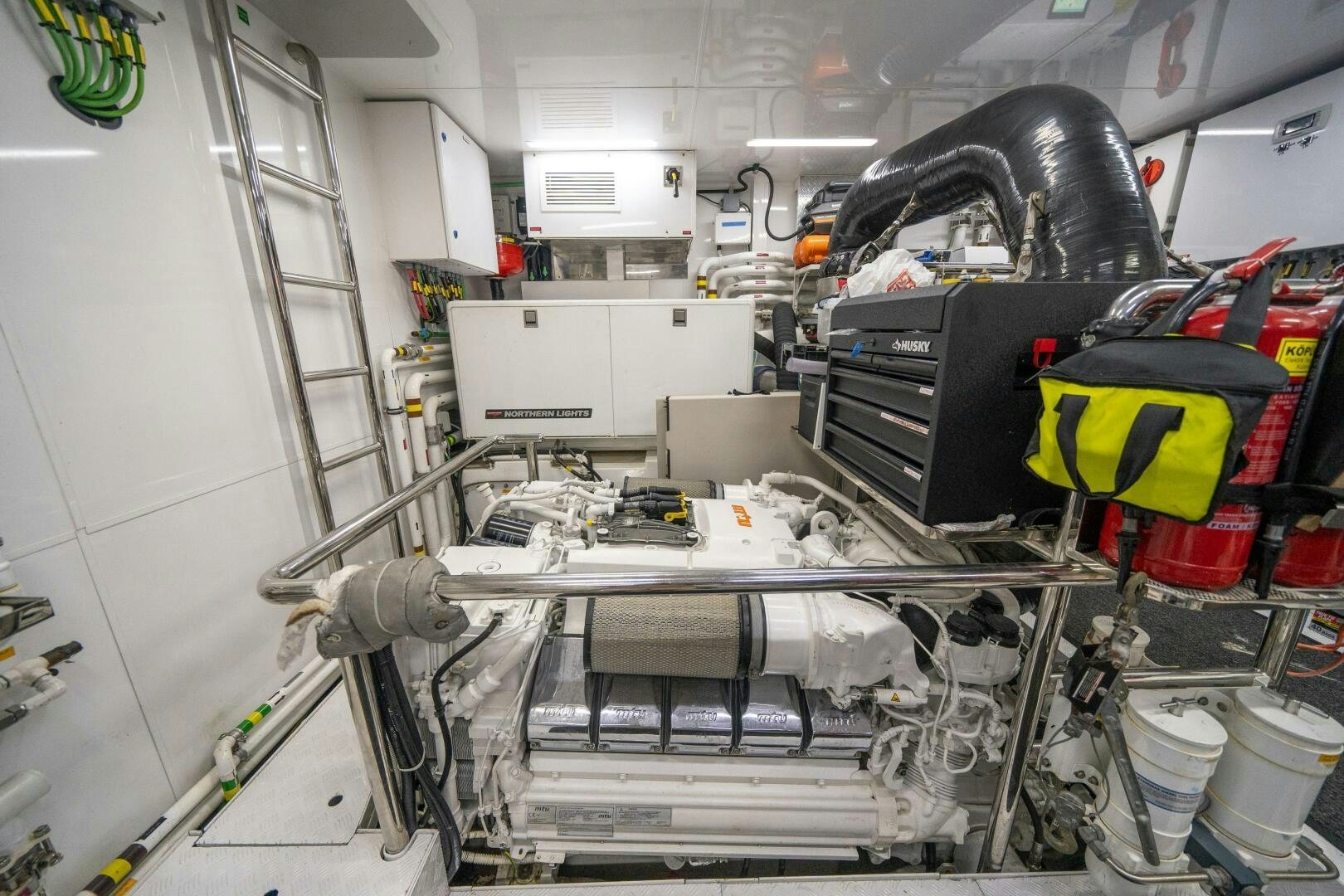 a car with a large engine aboard DAY ONE Yacht for Sale