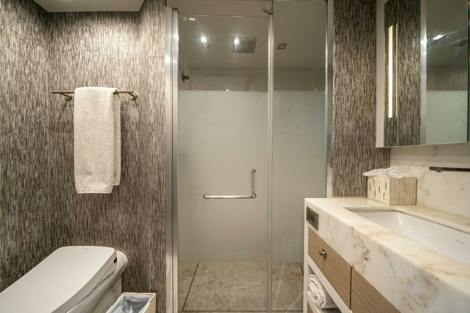 a bathroom with a sink and a toilet aboard DAY ONE Yacht for Sale