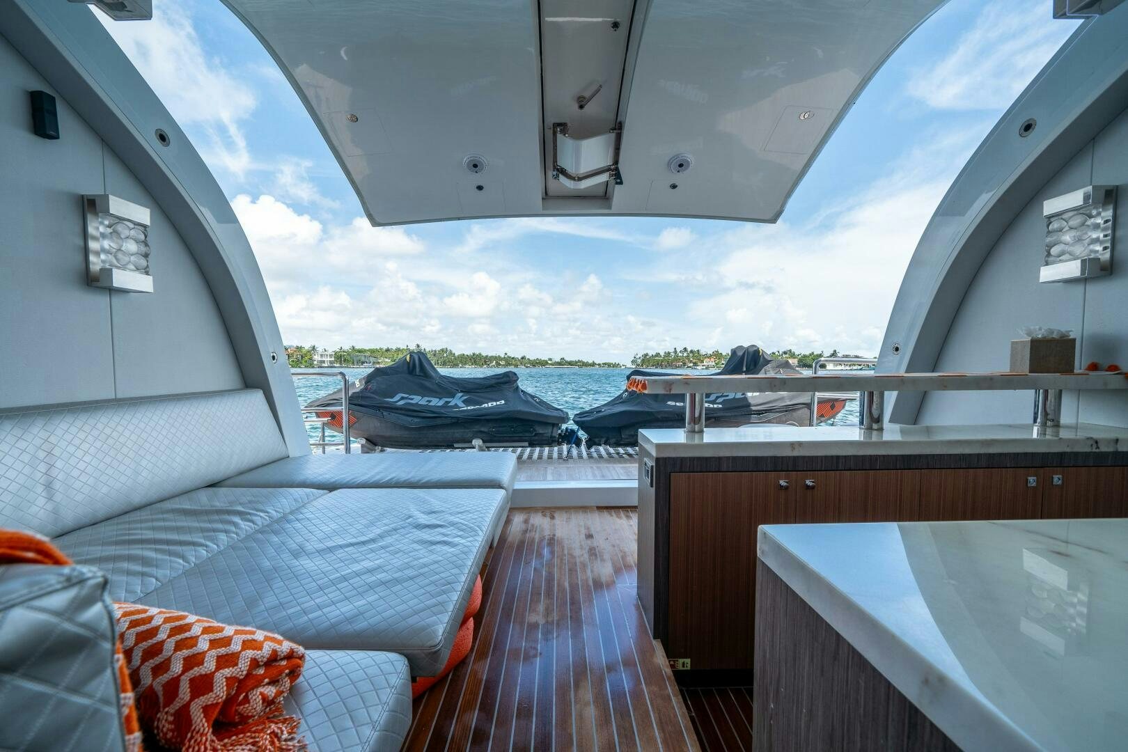 a room with a bed and a view of the water aboard DAY ONE Yacht for Sale