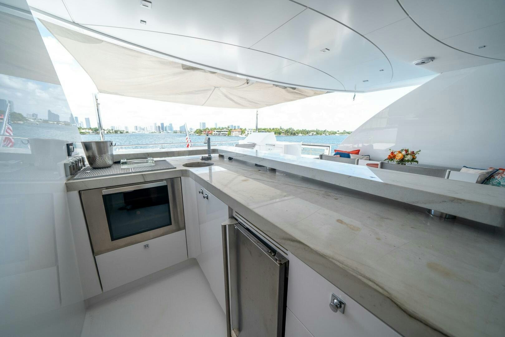 a kitchen with a large window aboard DAY ONE Yacht for Sale