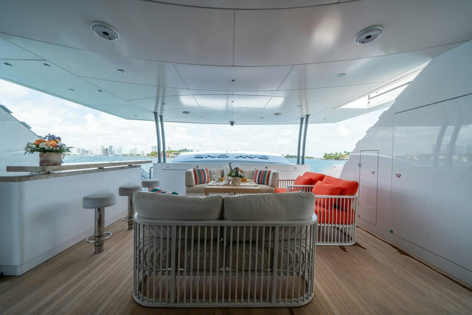 a room with a couch and a table and chairs aboard DAY ONE Yacht for Sale