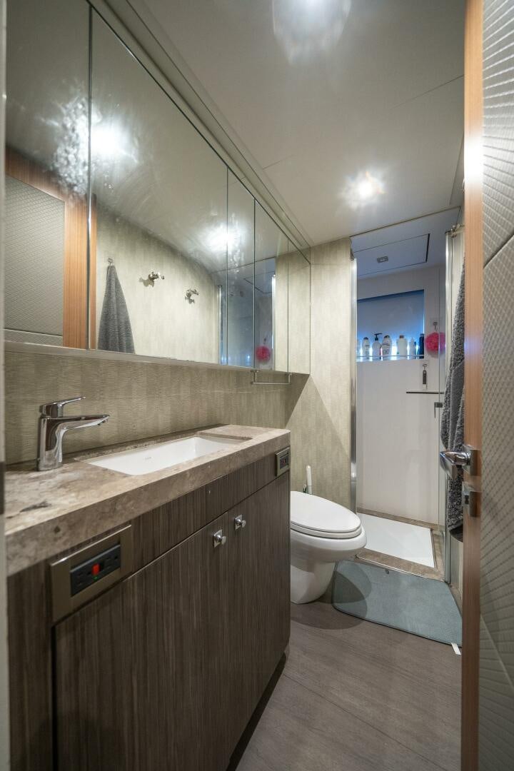 a bathroom with a sink and a toilet aboard DAY ONE Yacht for Sale