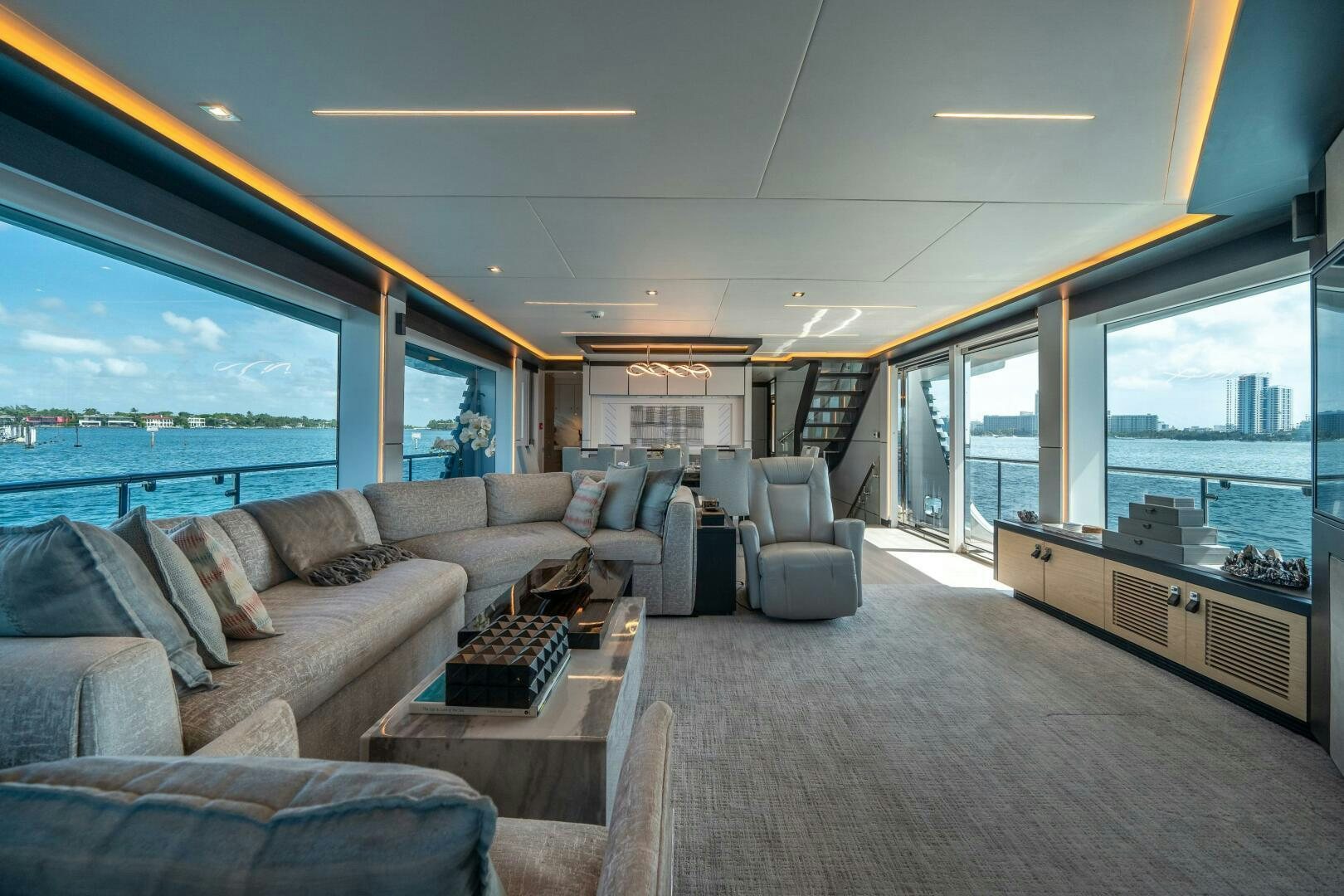 a living room with a large window aboard DAY ONE Yacht for Sale