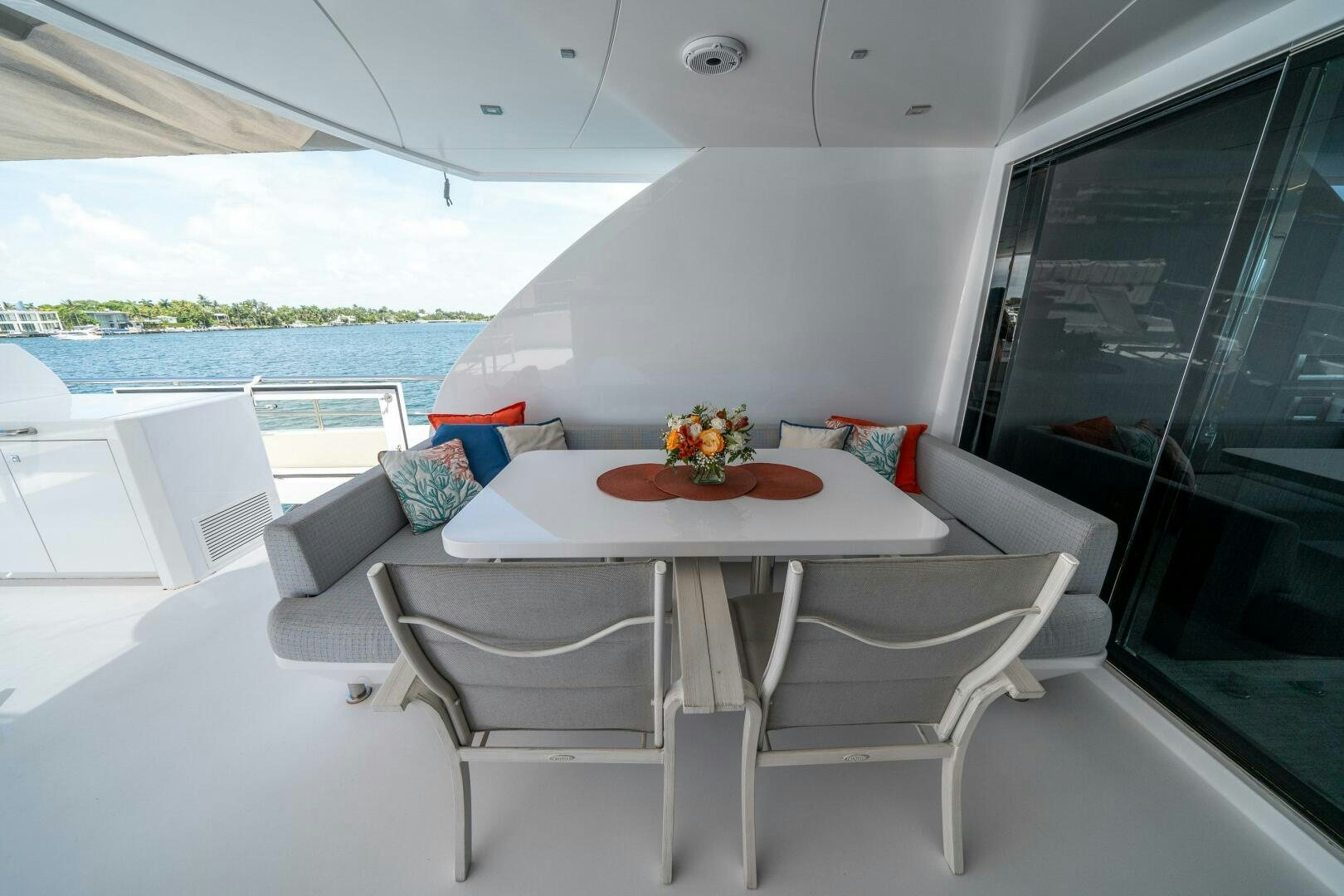a table with chairs on it aboard DAY ONE Yacht for Sale