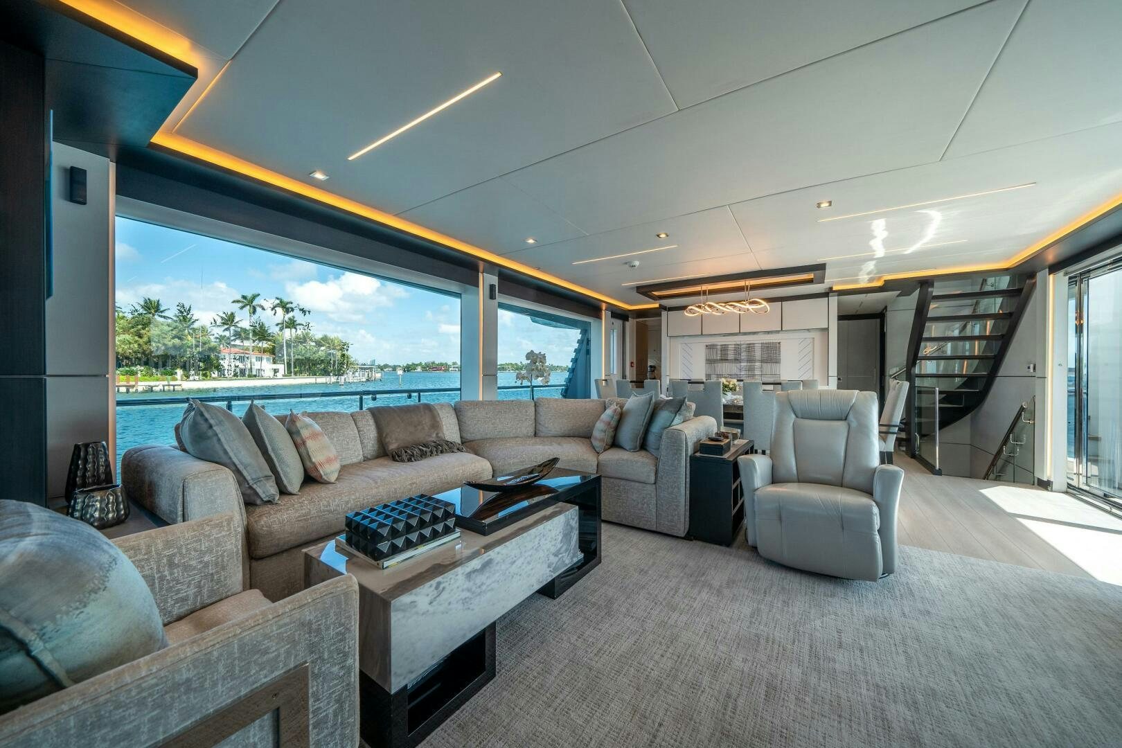 a living room with a large window aboard DAY ONE Yacht for Sale