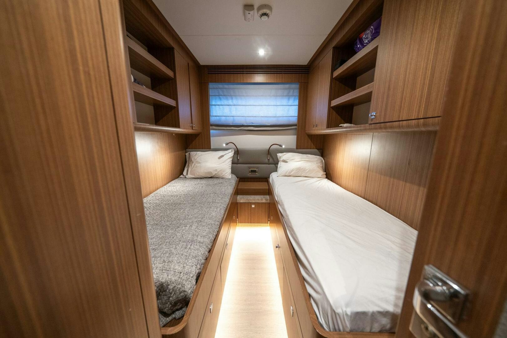 a room with a bed and a shelf aboard DAY ONE Yacht for Sale