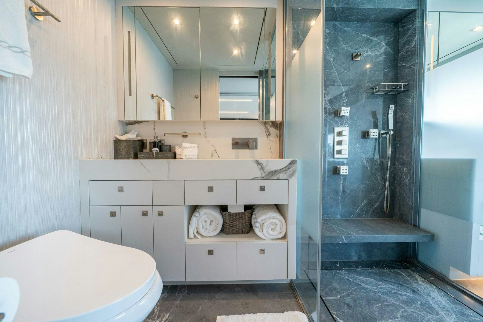 a bathroom with a glass shower aboard DAY ONE Yacht for Sale
