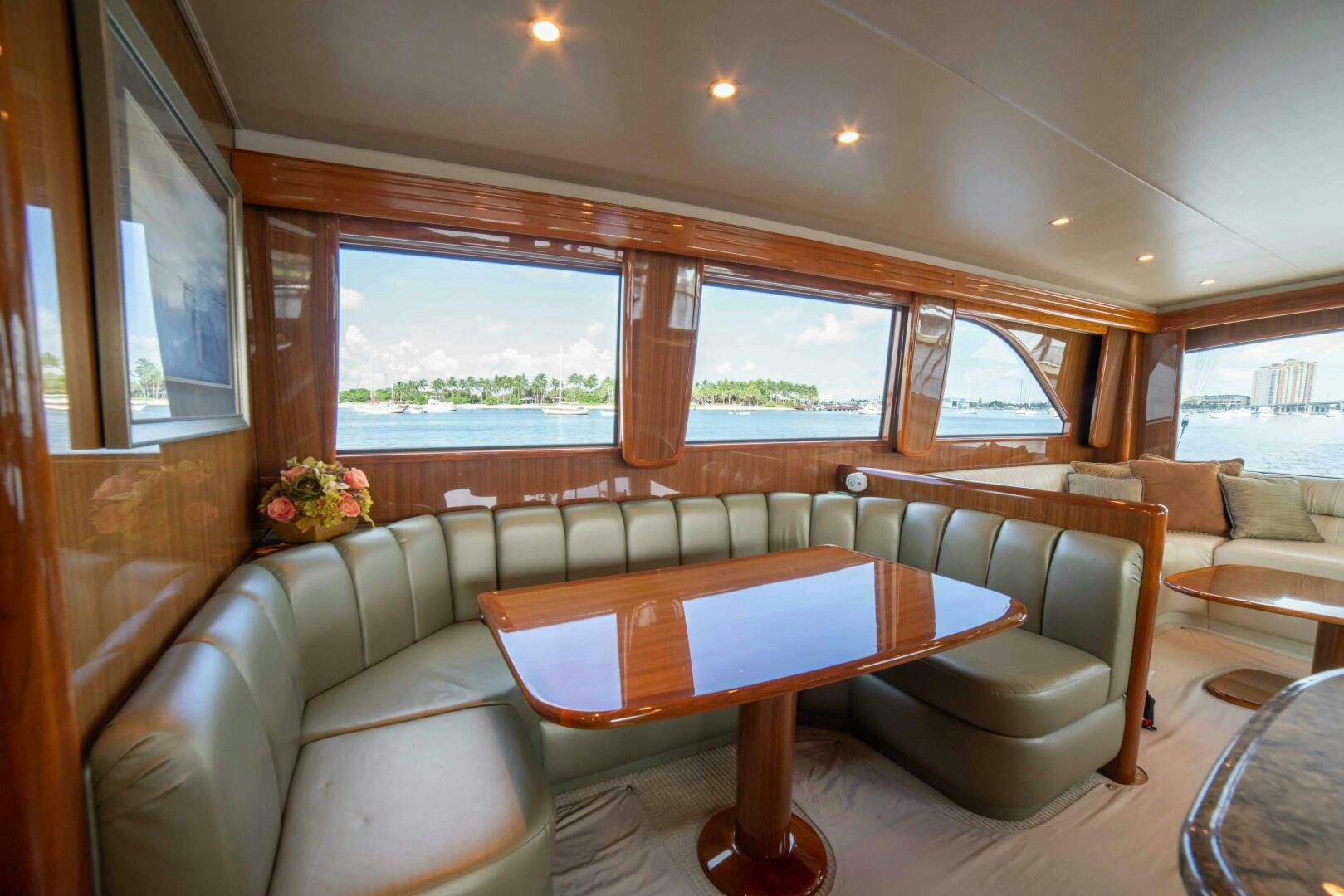 a living room with a table and chairs aboard Z MOTIVATION Yacht for Sale