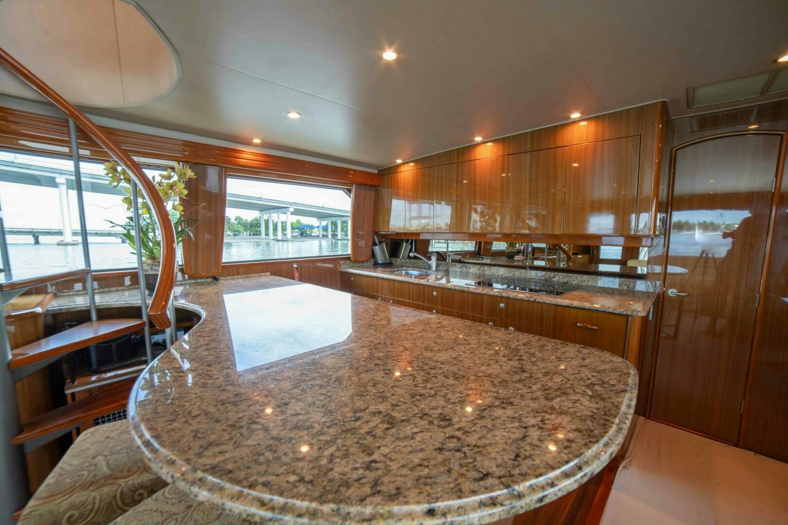 a large kitchen with a large marble counter top aboard Z MOTIVATION Yacht for Sale