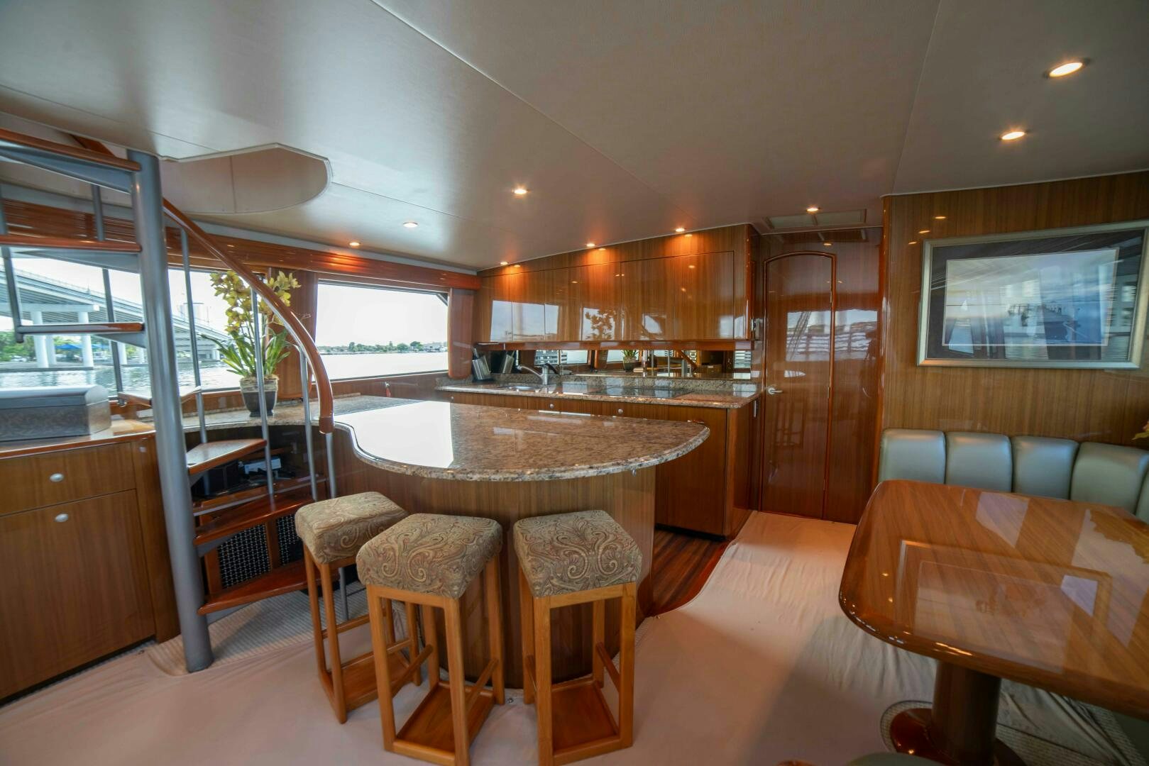 a large kitchen with a dining table aboard Z MOTIVATION Yacht for Sale