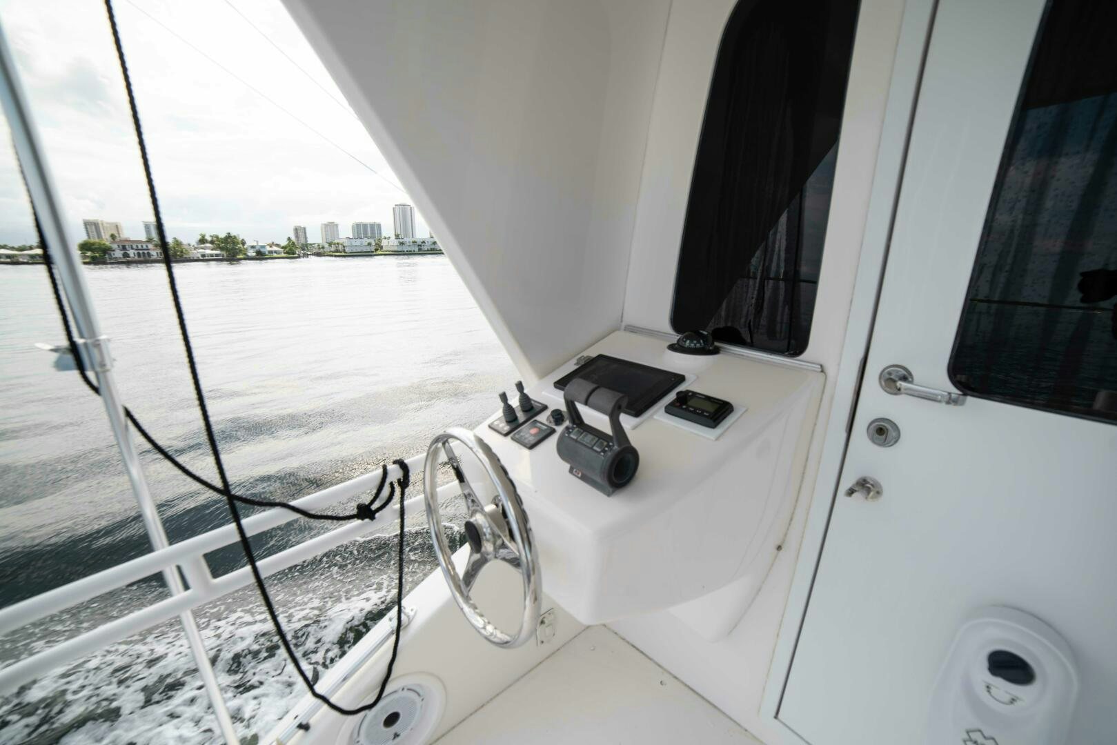 a white boat with a steering wheel aboard Z MOTIVATION Yacht for Sale