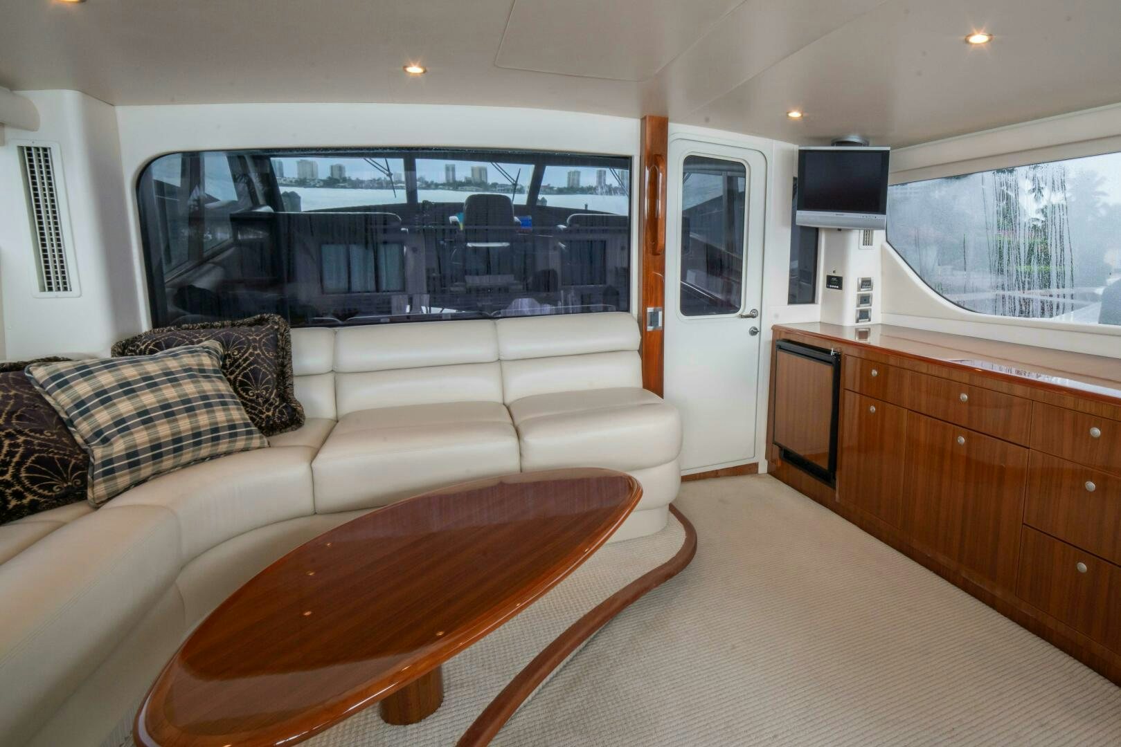 a living room with a couch and a table aboard Z MOTIVATION Yacht for Sale