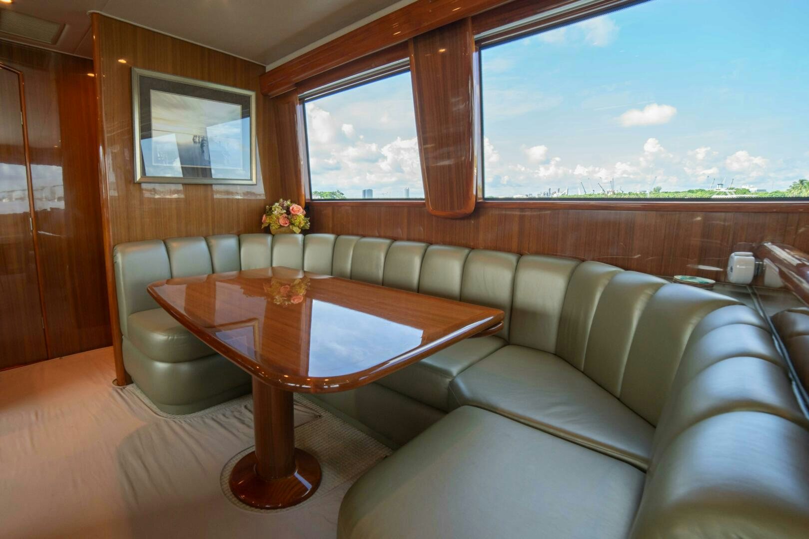 a living room with a table and chairs aboard Z MOTIVATION Yacht for Sale