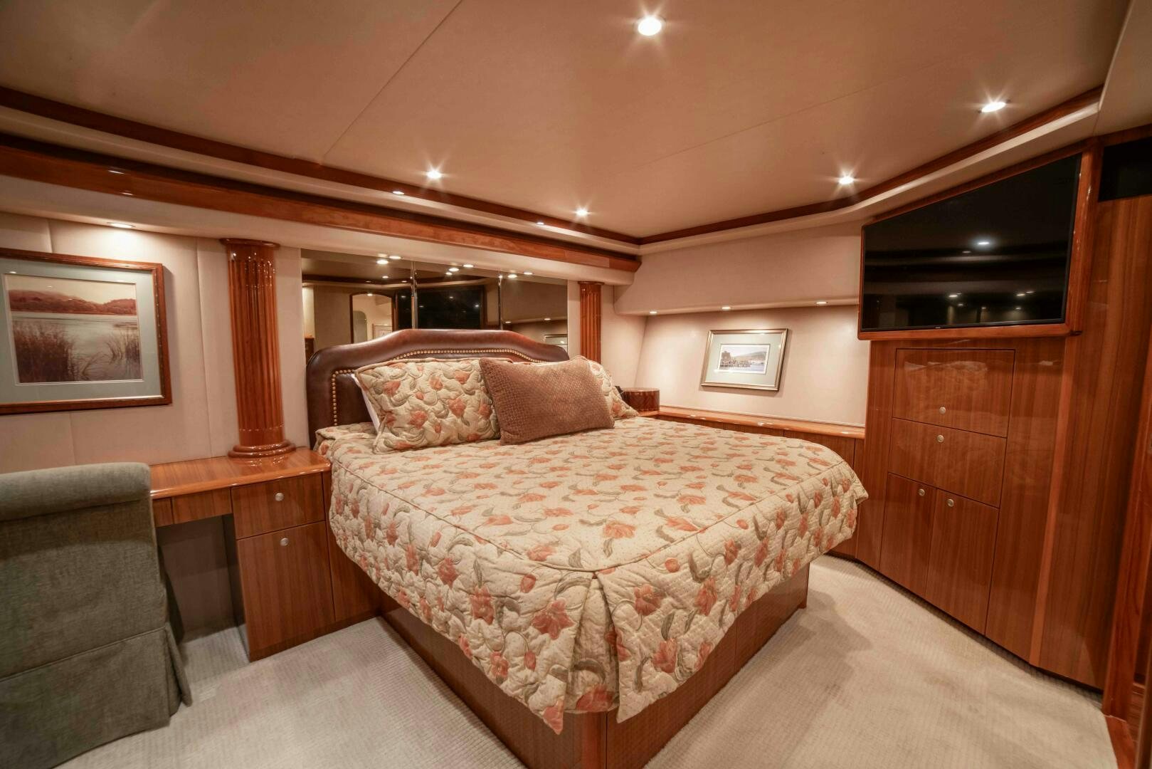 a bedroom with a bed and a chair aboard Z MOTIVATION Yacht for Sale