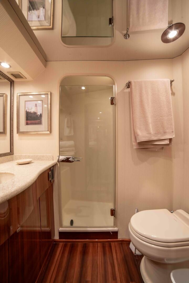 a bathroom with a shower and toilet aboard Z MOTIVATION Yacht for Sale