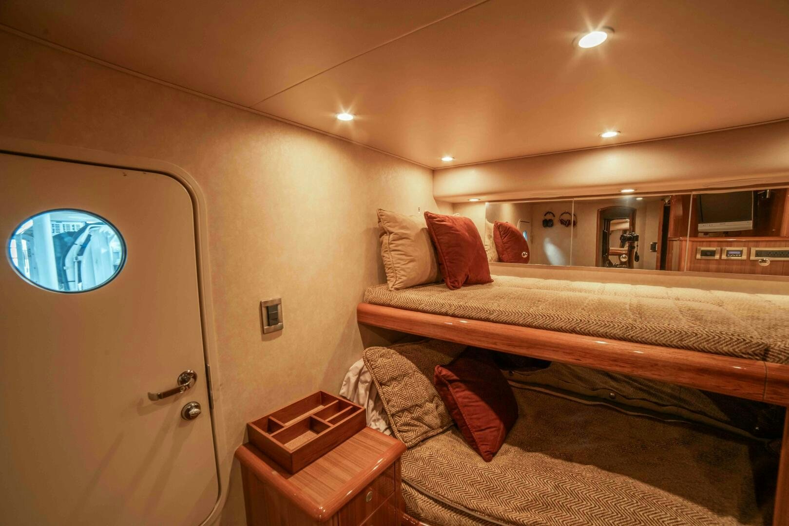 a room with a bed and a mirror aboard Z MOTIVATION Yacht for Sale