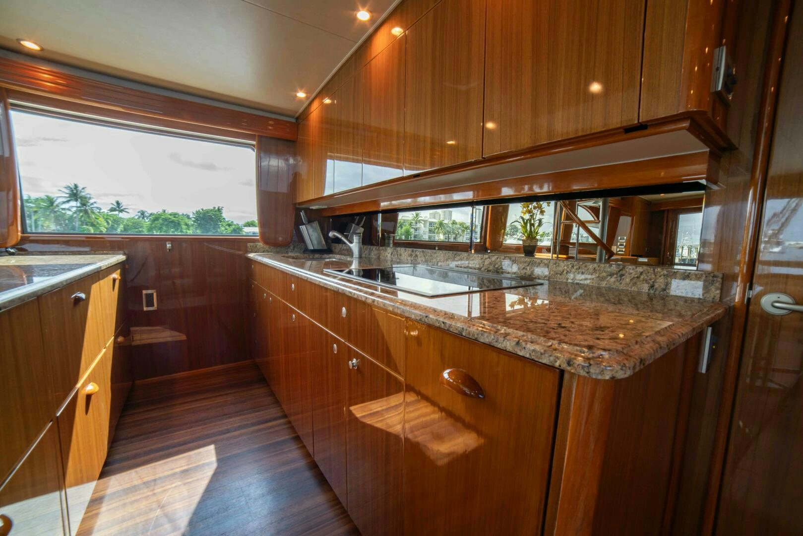 a kitchen with wooden cabinets aboard Z MOTIVATION Yacht for Sale