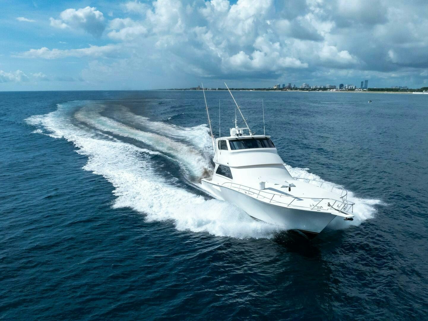 a white boat on the water aboard Z MOTIVATION Yacht for Sale