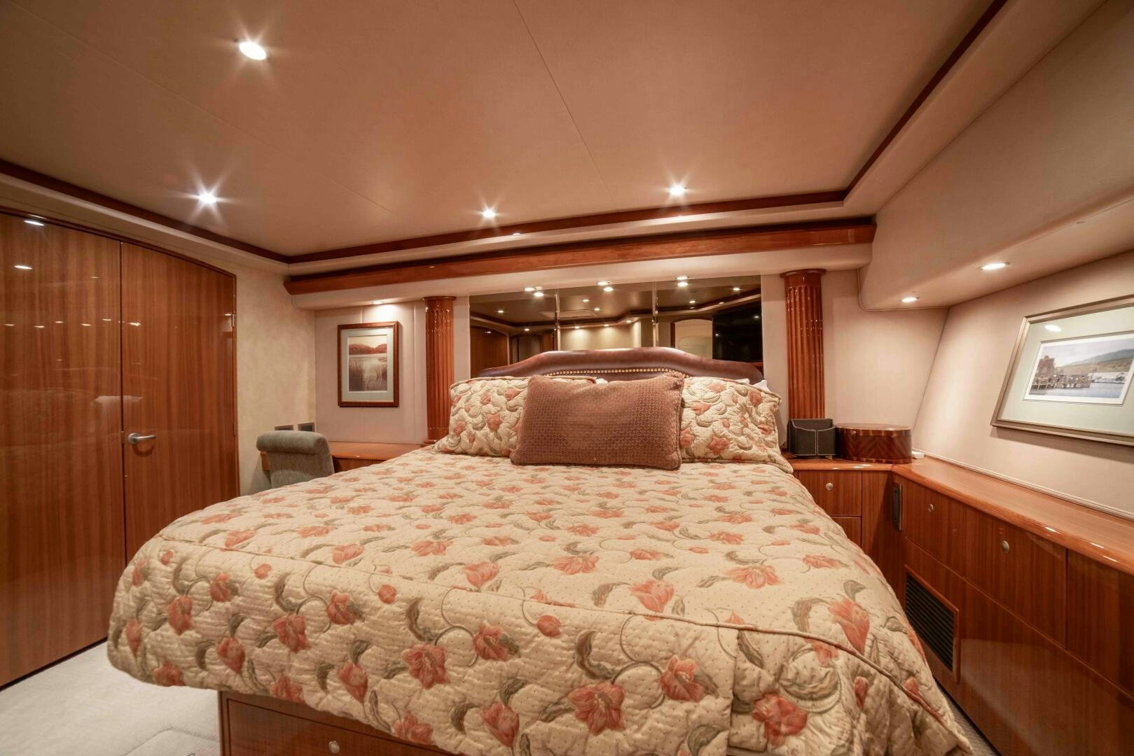 a bed with a floral blanket aboard Z MOTIVATION Yacht for Sale