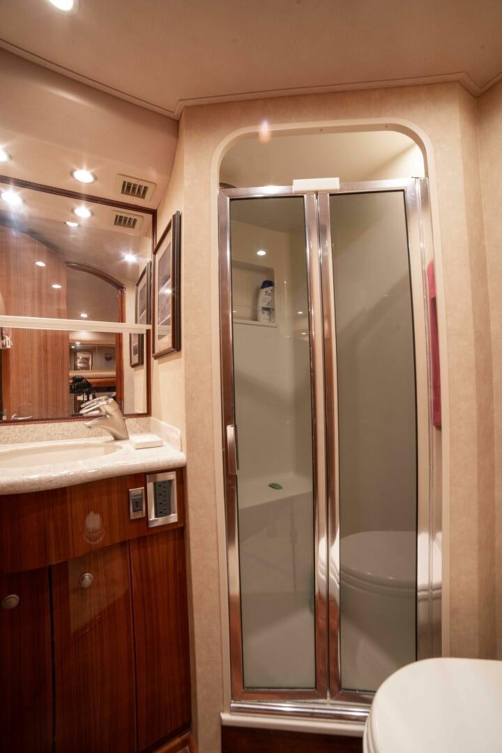 a bathroom with a glass shower aboard Z MOTIVATION Yacht for Sale