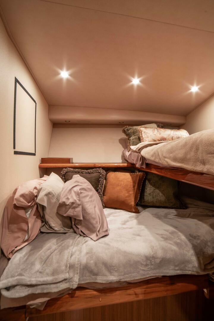 a room with a couple of beds aboard Z MOTIVATION Yacht for Sale