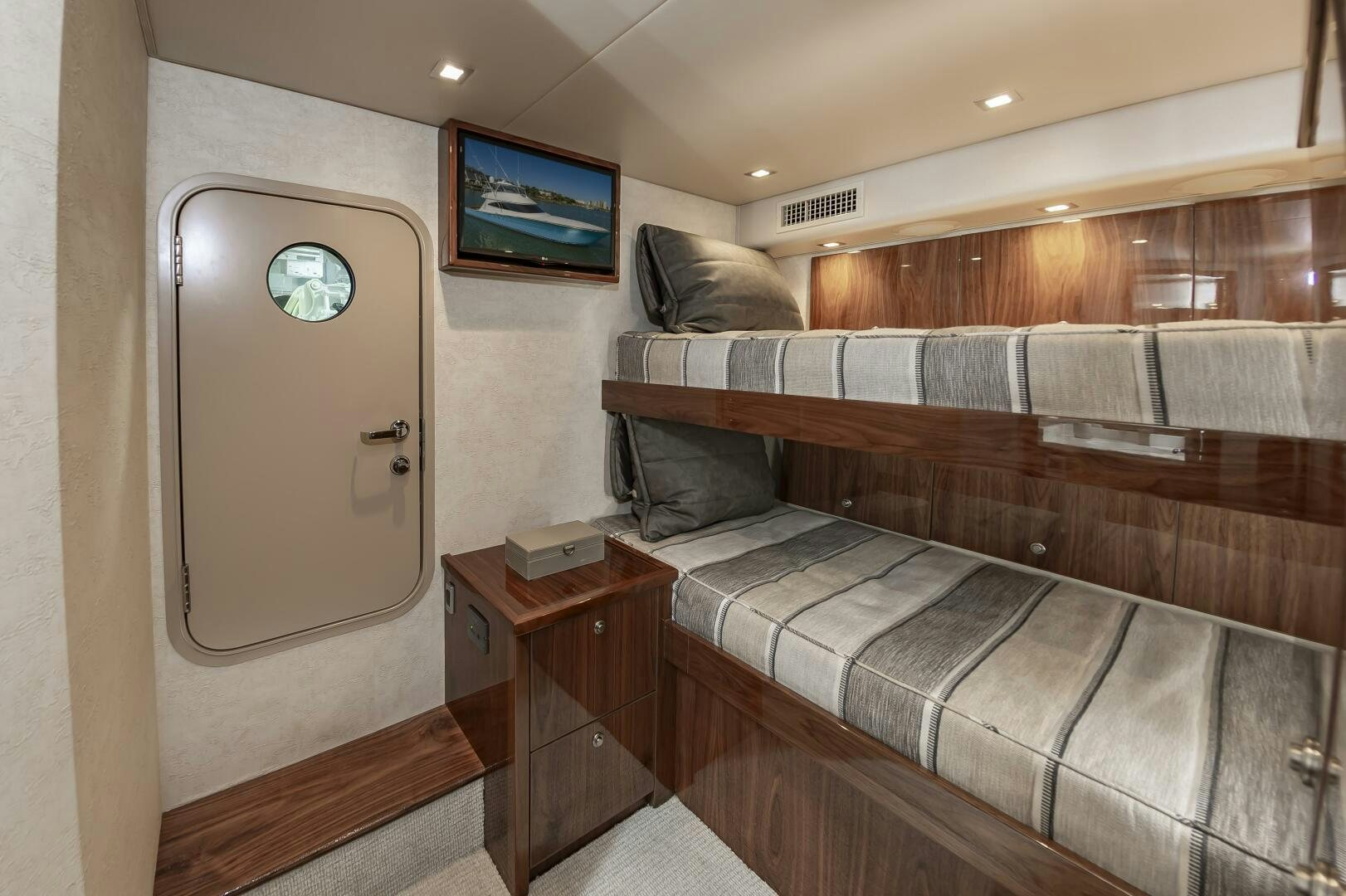 a room with a couch and a tv aboard MERCENARIA Yacht for Sale
